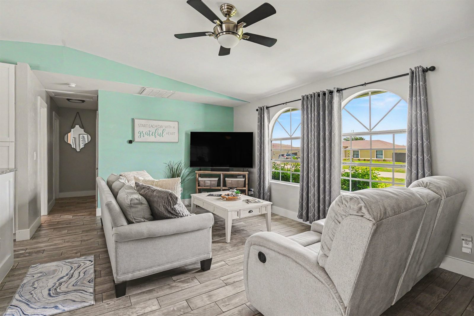Cape Escape living room with bright coastal decor